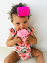 baby with pink leopard print babycino cup with roller in hair